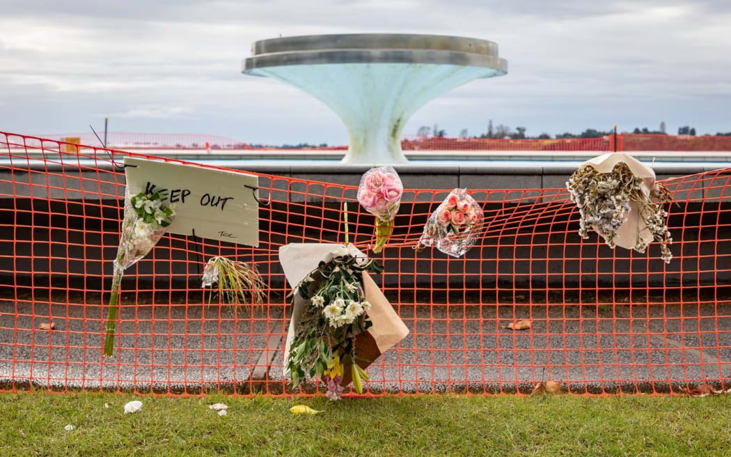 Flowers were left at the fountain at Memorial Park after a child drowned in May.
