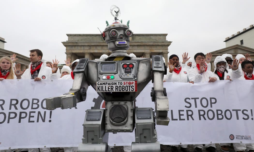 Protesters make their views known on killer robots in front of Berlin's Brandenburg gate, March 21 2019.