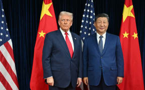 US President Donald Trump (L) and Chinese President Xi Jinping arrive for talks at the Gimhae Air Base, located next to the Gimhae International Airport in Busan on October 30, 2025. Donald Trump and Chinese leader Xi Jinping will seek a truce in their bruising trade war on October 30, with the US president predicting a "great meeting" but Beijing being more circumspect. (Photo by ANDREW CABALLERO-REYNOLDS / AFP)