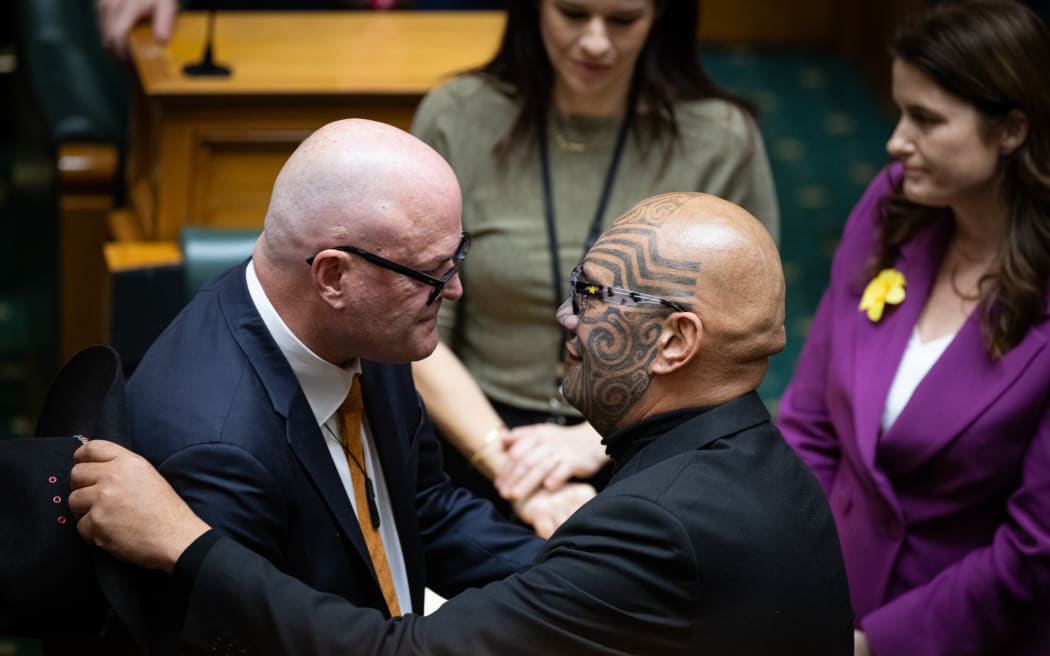 Todd Muller is embraced by Te Paati Maori Co-leader Rawiri Waititi after his valedictory address.