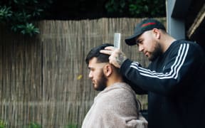 Barber Quinten, who goes by Q.