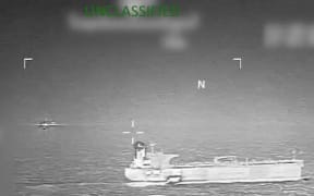 This screen grab from a video posted on the X account of US Southern Command (SOUTHCOM) on January 15, 2026, shows what the US military says is a pre-dawn January 15 action to apprehend the Tanker Veronica in the Carribean Sea. The United States has seized another tanker in the Caribbean in its campaign to control oil leaving Venezuela, US Southern Command said Thursday. Marines and sailors apprehended the Tanker Veronica without incident in a pre-dawn raid, the military command responsible for Central, South America and the Caribbean said on social media, with a video showing soldiers rappelling onto a vessel's deck. (Photo by HANDOUT / US SOUTHERN COMMAND / AFP) / RESTRICTED TO EDITORIAL USE - MANDATORY CREDIT "AFP PHOTO /  US SOUTHERN COMMAND / HANDOUT" - HANDOUT - NO MARKETING NO ADVERTISING CAMPAIGNS - DISTRIBUTED AS A SERVICE TO CLIENTS