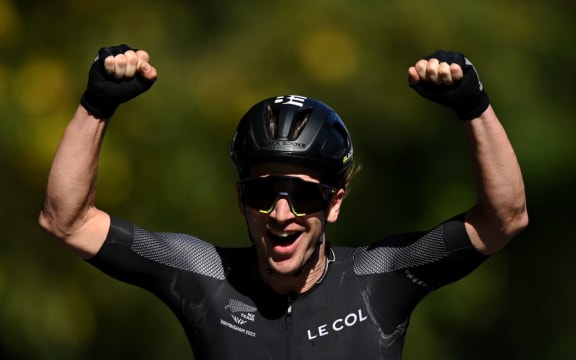 Aaron Gate celebrates winning gold as he crosses the finish line of the men's road race at the Commonwealth Games. 7 August, 2022.