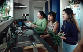 (L-R) Hương, Ly, and Hà prepare lunch