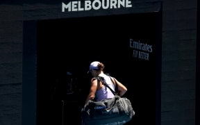 Australia's Ashleigh Barty walks off the court after losing against Czech Republic's Karolina Muchova during their women's singles quarter-final match on day ten of the Australian Open tennis tournament in Melbourne on February 17, 2021.