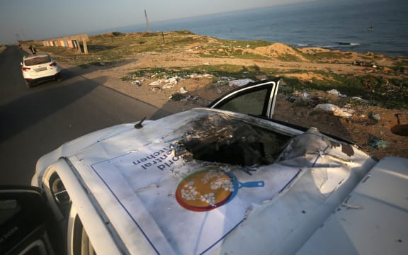 A view of the destroyed roof of a vehicle where employees from the World Central Kitchen (WCK), including foreigners, were killed in an Israeli airstrike, according to the NGO as the Israeli military said it was conducting a thorough review at the highest levels to understand the circumstances of this "tragic" incident, amid the ongoing conflict between Israel and Hamas, in Deir Al-Balah, in the central Gaza, Strip April 2, 2024. (Photo by Yasser Qudihe / Middle East Images / Middle East Images via AFP)