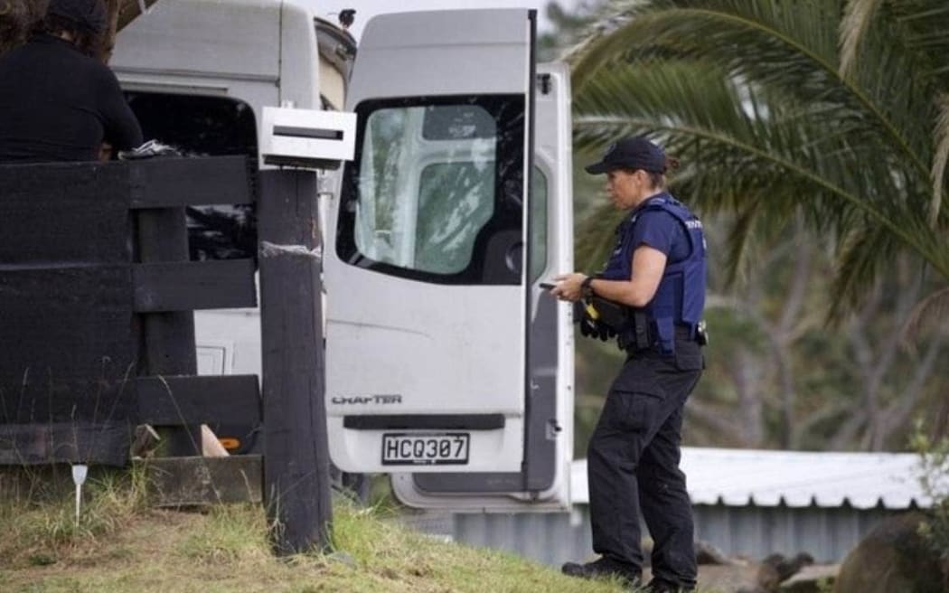 Police at an address on Red Hills Road in Massey on Wednesday morning.
