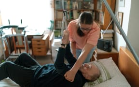 Community support workers assist people who need help with daily living tasks.