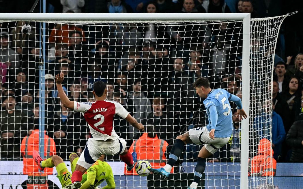 Manchester City defender John Stones scores the equalising goal against Arsenal in their English Premier League clash at Etihad Stadium in Manchester.
