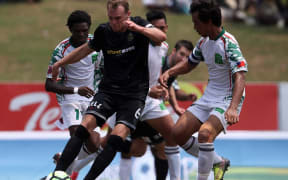Team Wellington's Taylor Schrijvers under pressure from the Lupe Ole Soaga defence