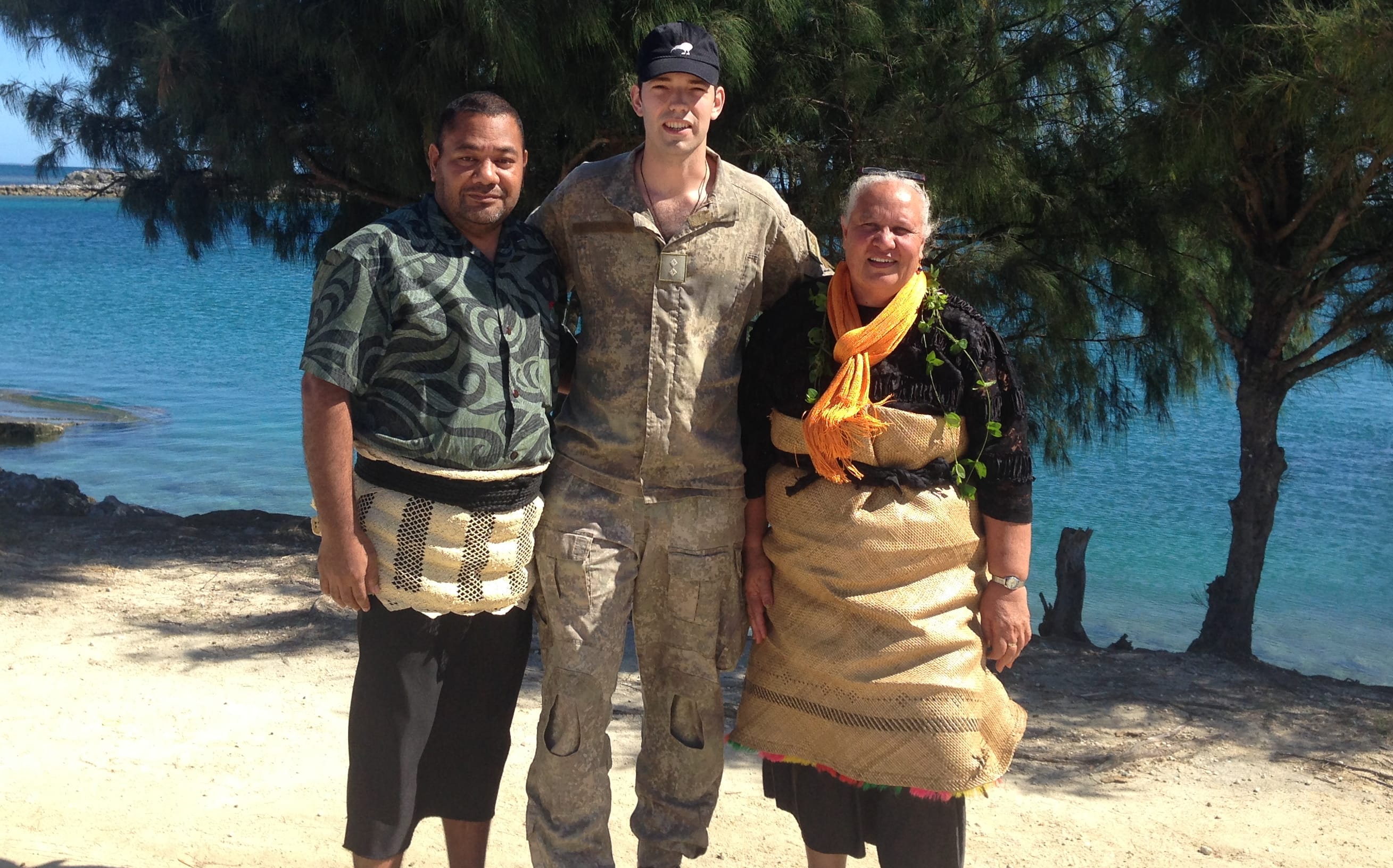 Lieutenant Aidan Bilbe (centre) with Solomone Pule (left), who is the principal of Ha'apai High School, and Olivia Mafileo (right) from Tonga’s Ministry of Education.