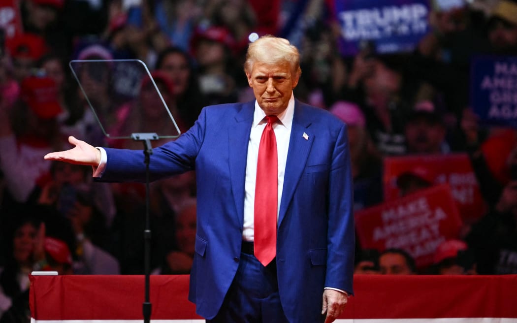 Former US President and Republican presidential candidate Donald Trump gestures after speaking at a campaign rally at Madison Square Garden in New York, October 27, 2024. (Photo by ANGELA WEISS / AFP)