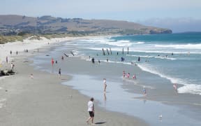 Dunedin residents took to St Clair Beach to get out of the heat of the day.