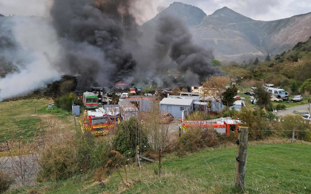 A fire which tore through dozens of cars on a rural property between Nelson and Blenheim has now been contained.