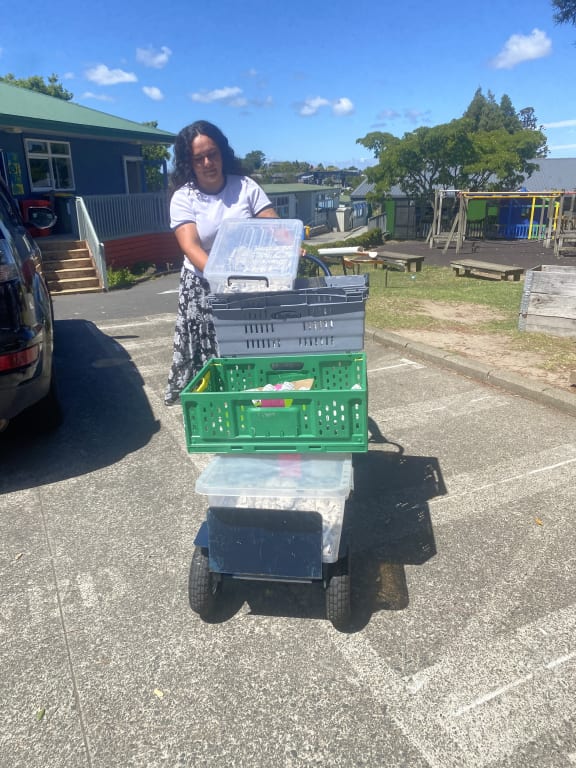 Receptionist Patricia delivering lunches at Massey Primary School.