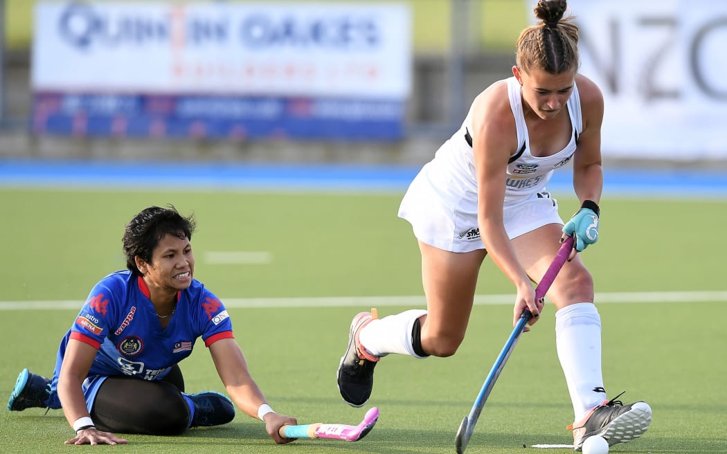 Catherine Tinning beats Malaysia's Norazlin Sumantri in game two.