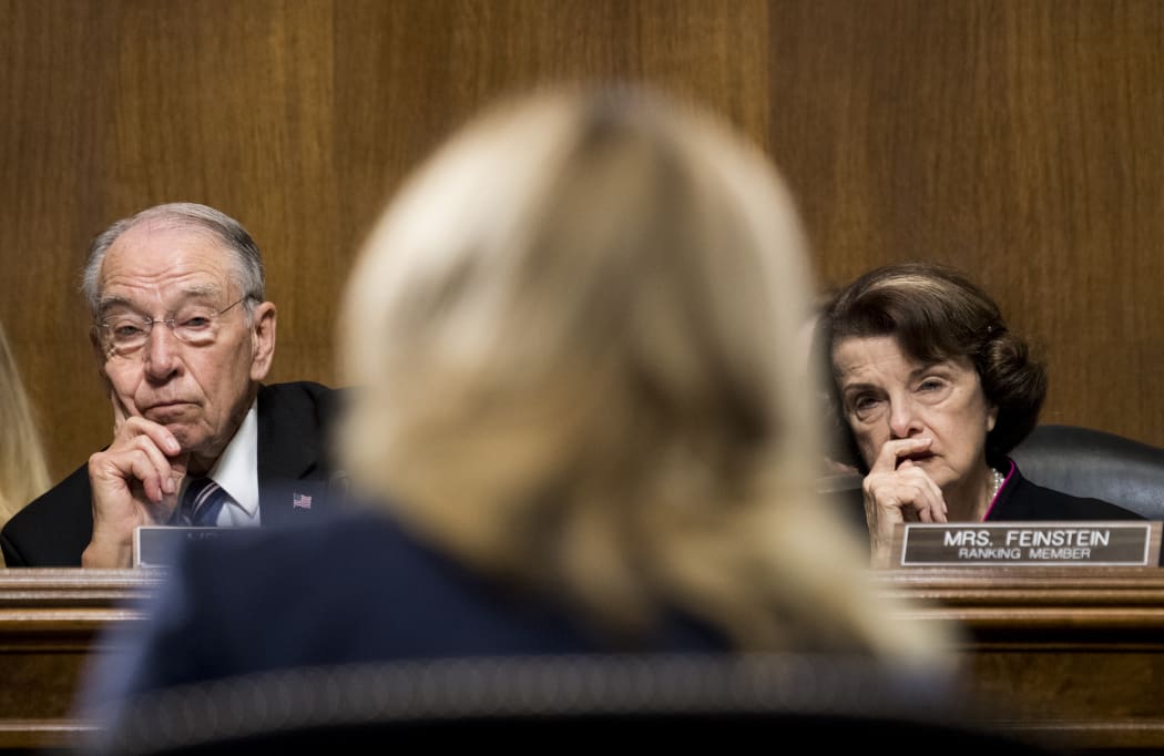 Republican Senator Chuck Grassley and Democratic Senator Dianne Feinstein listen to Christine Blasey Ford testifying during the Senate Judiciary Committee hearing on the nomination of Brett Kavanaugh the Supreme Court.