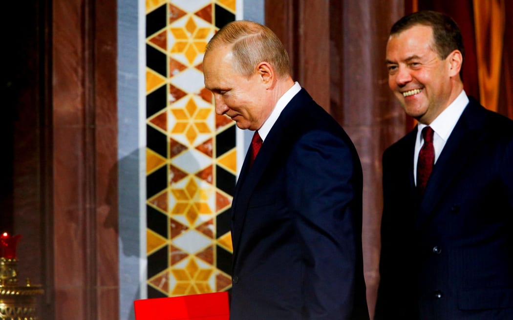 Russian President Vladimir Putin (L) and Prime Minister of Russia Dmitry Medvedev (R) attend the Easter service at the Cathedral of Christ the Saviour in Moscow, Russia on April 27, 2019. The Russian Orthodox Church celebrates feasts according to the Julian calendar.