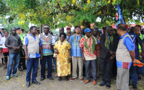 Bougainville's retiring president, John Momis (centre with blue and white shirt) alongside his wife Elizabeth and other officials at Bel Isi Park in Buka at the commencement of polling in the autonomous Papua New Guinea region's independence referendum, November 2019.