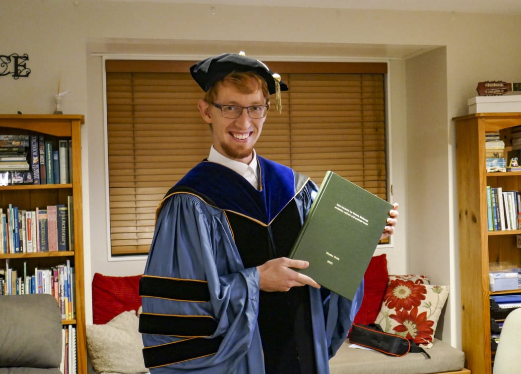 Wesley Webb with his graduation regalia.