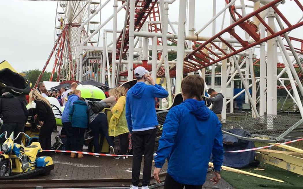 Nine children and two adults have been injured when a rollercoaster carriage derailed at a theme park in Scotland.