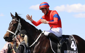 James Mcdonald riding #4 Verry Elleegant celebrates after winning race 7, the Lexus Melbourne Cup during 2021 Melbourne Cup Day at Flemington Racecourse on November 02, 2021 in Melbourne, Australia.