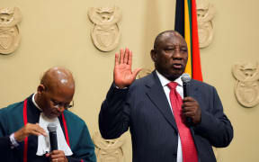 South Africa's new president Cyril Ramaphosa is sworn into office by South Africa's Chief Justice Mogoeng Mogoeng