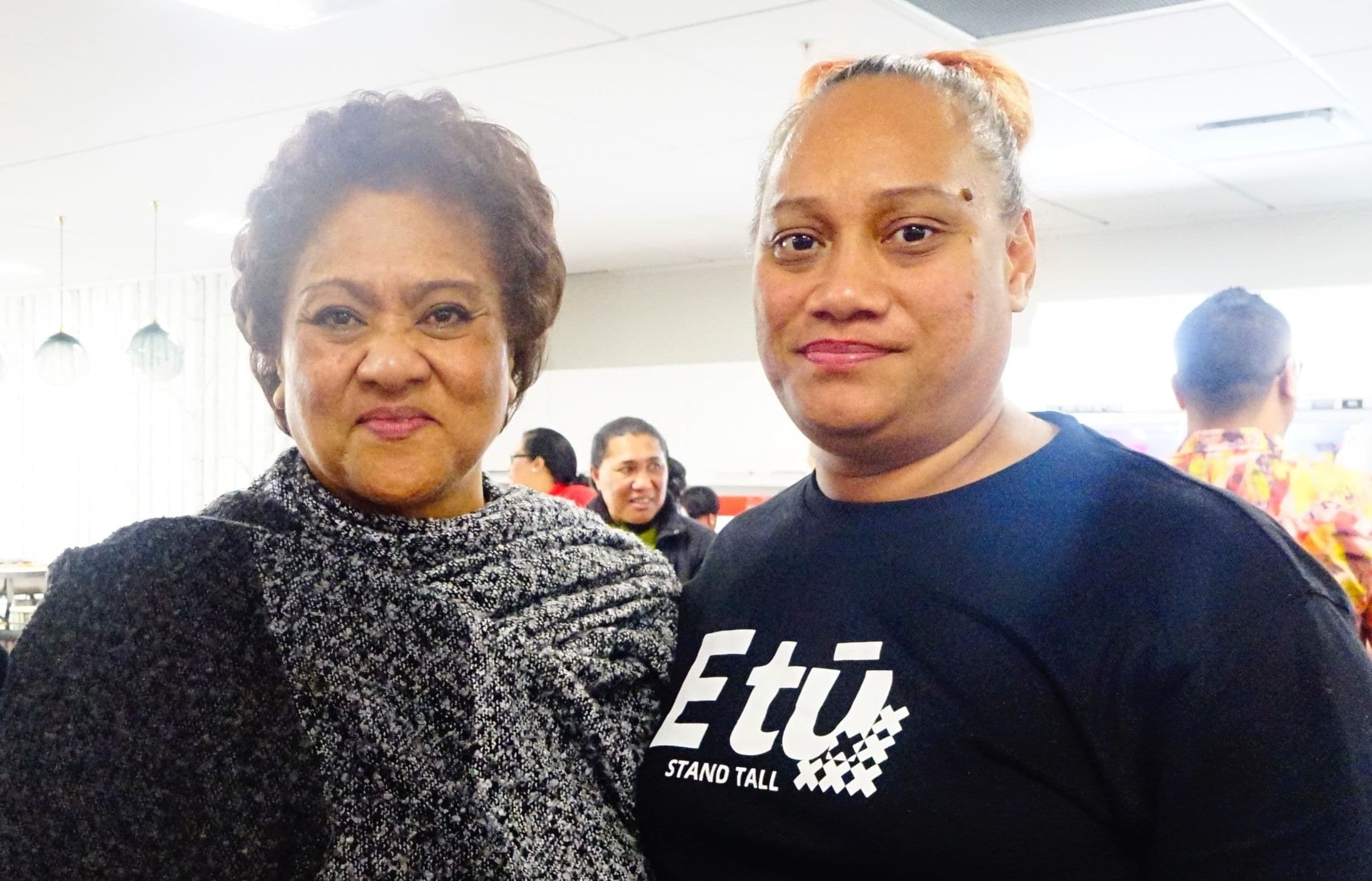 Maria Latu (R) works 60 hours a week as a team leader and is paid $17 an hour.