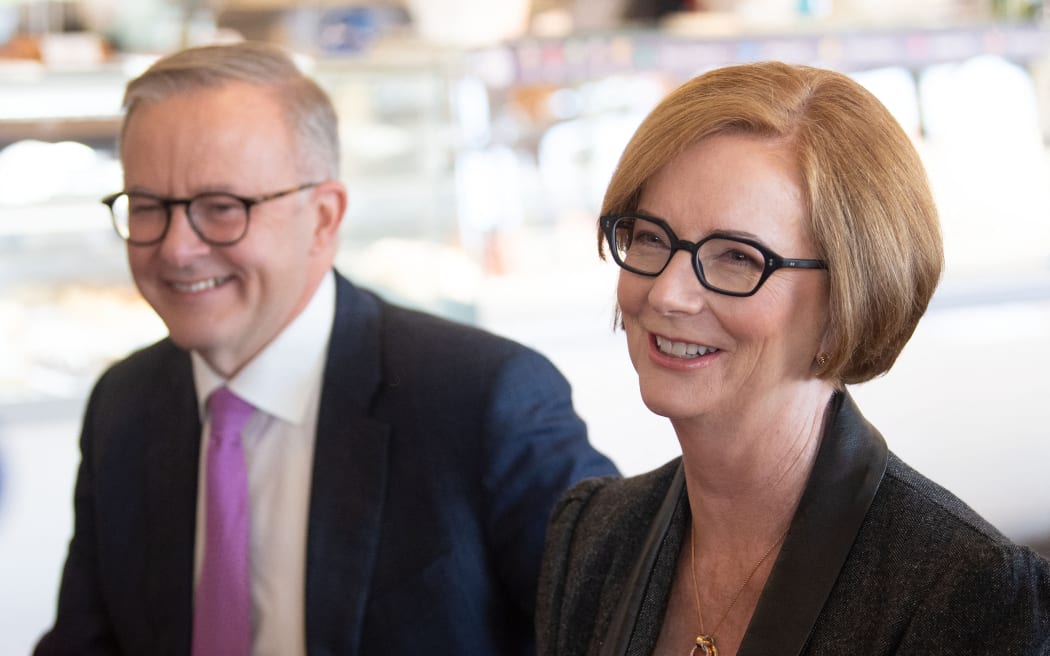 Australia's Opposition Labor Party leader Anthony Albanese (L) meets with former Australian prime minister Julia Gillard (R) at a cafe in the suburb of Sturt in Adelaide on 20 May 2022, ahead of the May 21 general election.