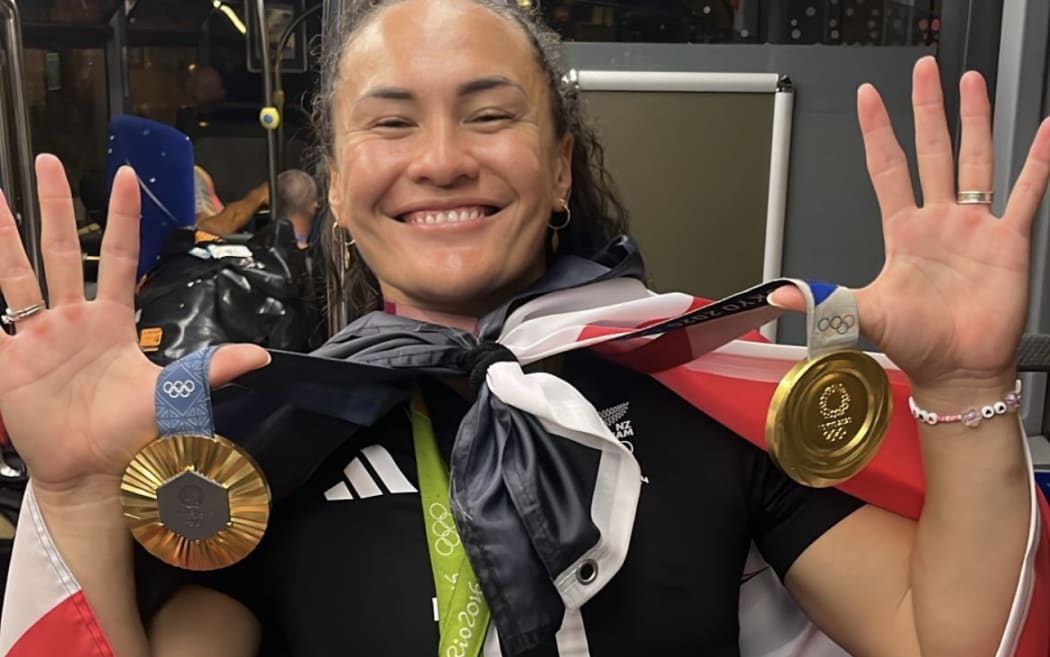 Portia Woodman-Wickliffe with medals after winning gold in Paris.