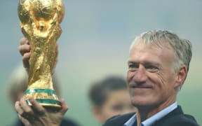 France football manager Didier Deschamps holding the FIFA World Cup, 2018.