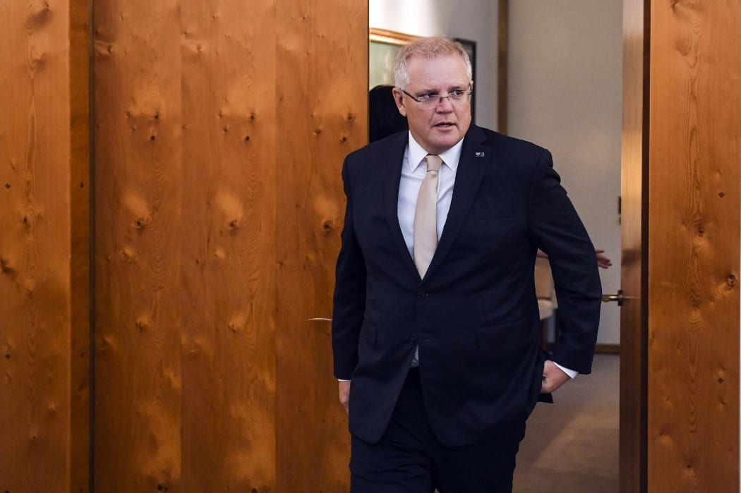 Australian Prime Minister Scott Morrison arrives to welcome Indonesian President Joko Widodo ahead of signing the official visitors book at Parliament House in Canberra on February 10, 2020.
