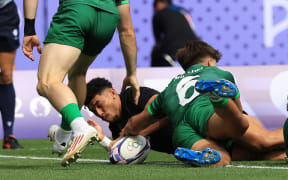 Ngarohi McGarvey-Black scores for New Zealand All Blacks Sevens against Ireland in pool play at the Paris Olympics at Stade de France.