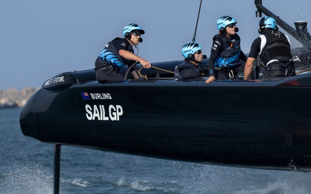 Peter Burling, co-CEO and driver of New Zealand SailGP Team, Leo Takahashi, flight controller of New Zealand SailGP Team, Liv Mackay, strategist of New Zealand SailGP Team  in action during practice ahead of the Emirates Dubai Sail Grand Prix presented by P&O Marinas in Dubai, UAE. Friday 22 November 2024. Photo: Felix Diemer for SailGP. Handout image supplied by SailGP