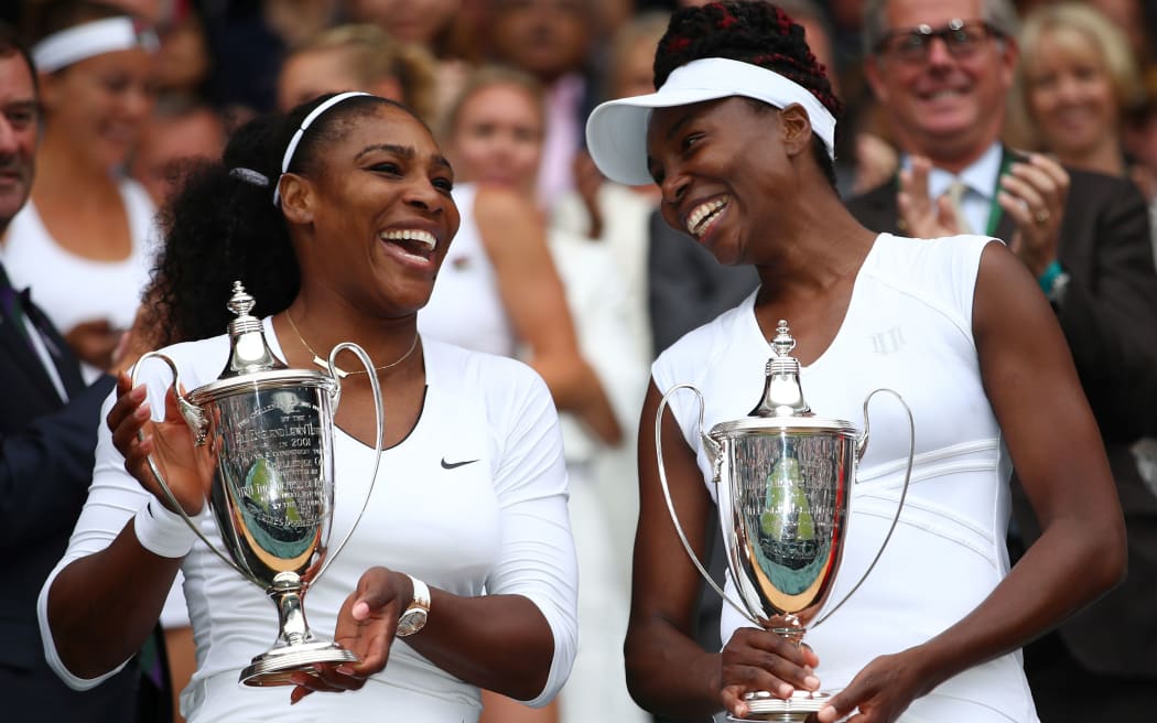 Sernea and Venus Williams pose with their doubles titles at Wimbledon, 2016.