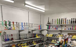 Customs says large numbers of knives and drug paraphernalia were found in the couple’s home.