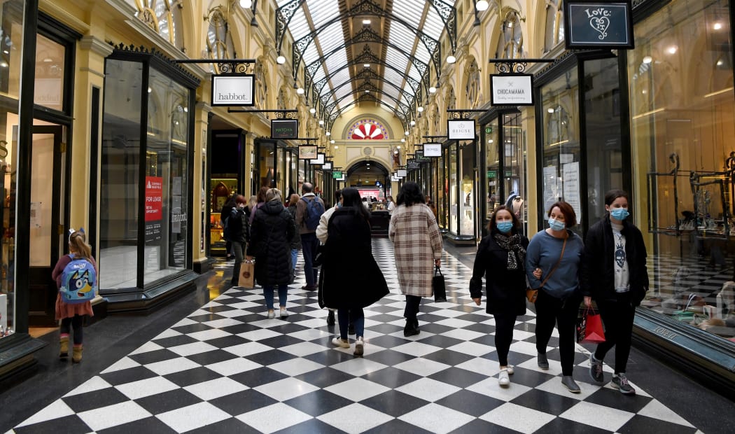 Shoppers return to the central business district in Melbourne on July 7, 2021, after the city announced an easing of Covid restrictions.