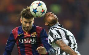 UEFA Champions League Final 2015. Barcelona's Gerard Pique fights for the ball with Arturo Vidal of Juventus.