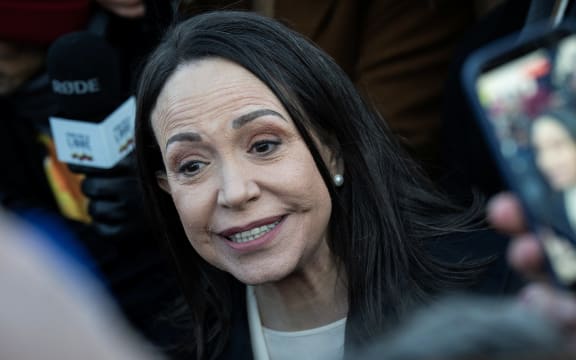 Venezuelan opposition leader Maria Corina Machado speaks to reporters as she departs the US Capitol after meeting with US senators on January 15, 2026 in Washington, DC. US President Donald Trump met earlier Thursday with Venezuelan opposition leader Machado, whose pro-democracy movement he has sidelined since toppling her country's leader, and whose Nobel Peace Prize he openly envies. (Photo by Drew ANGERER / AFP)