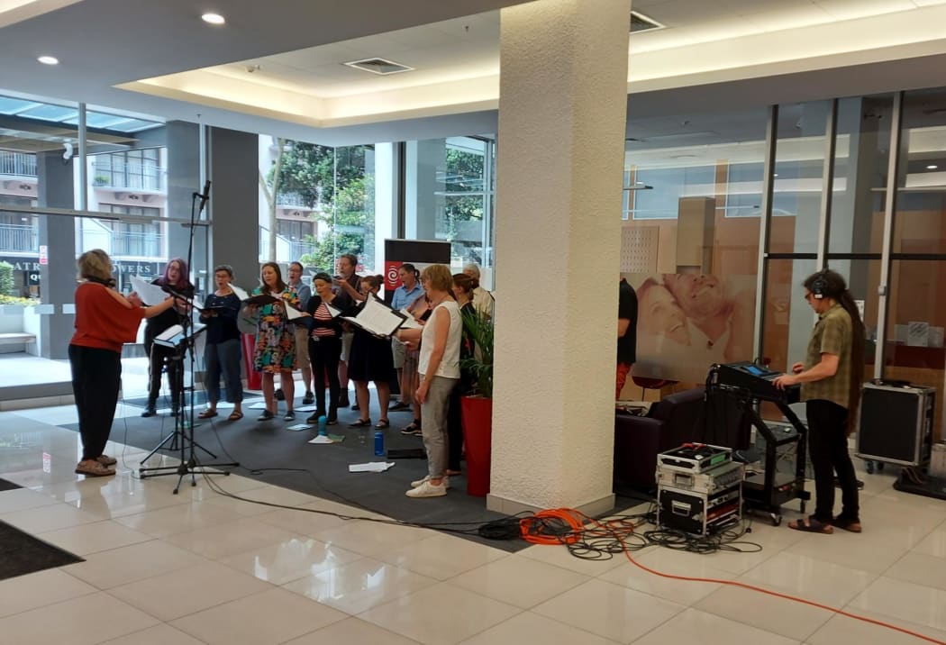 Nota Bene sing Christmas Carols from the lobby of RNZ House in Wellington.