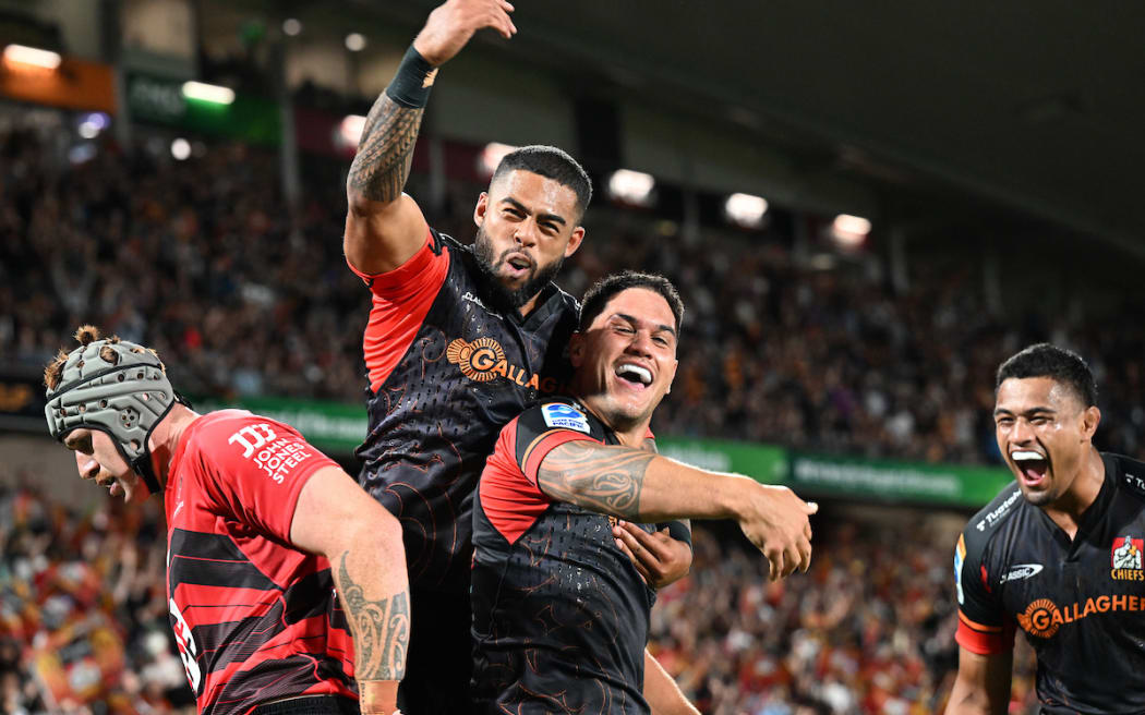 Quinn Tupaea and Gideon Wrampling celebrate.