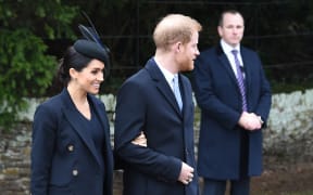 Meghan, Duchess of Sussex and Britain's Prince Harry, Duke of Sussex, depart after the Royal Family's traditional Christmas Day service at St Mary Magdalene Church in Sandringham, Norfolk, eastern England, on December 25, 2018.