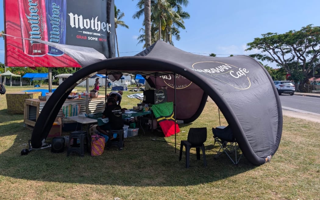 Ivan Oswald and the staff of Nambawan Cafe temporarily ran the cafe in a tent powered by his Electric Truck.