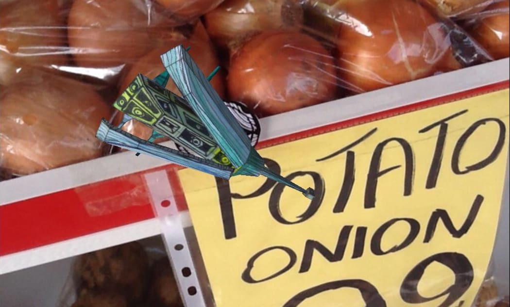 An Awhi Creature hovers over a stack of potato onions.