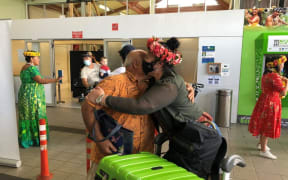The airport at Avarua was packed with family and friends waiting for the first arrivals.