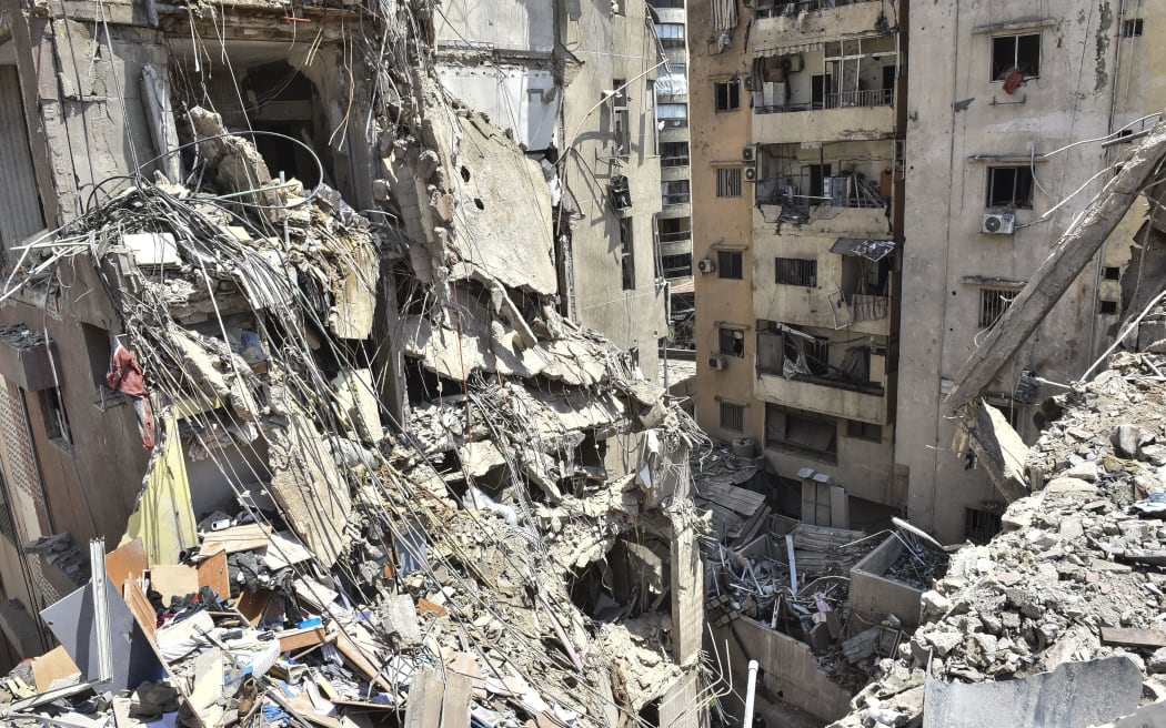 A view is showing a partially destroyed building, which is being targeted by the Israeli army, in Beirut, Lebanon, on July 31, 2024. The Israeli army is also claiming that it is killing key Fuad Shukr, Hezbollah's top military commander, in the strike. (Photo by Fadel Itani/NurPhoto) (Photo by Fadel Itani / NurPhoto / NurPhoto via AFP)