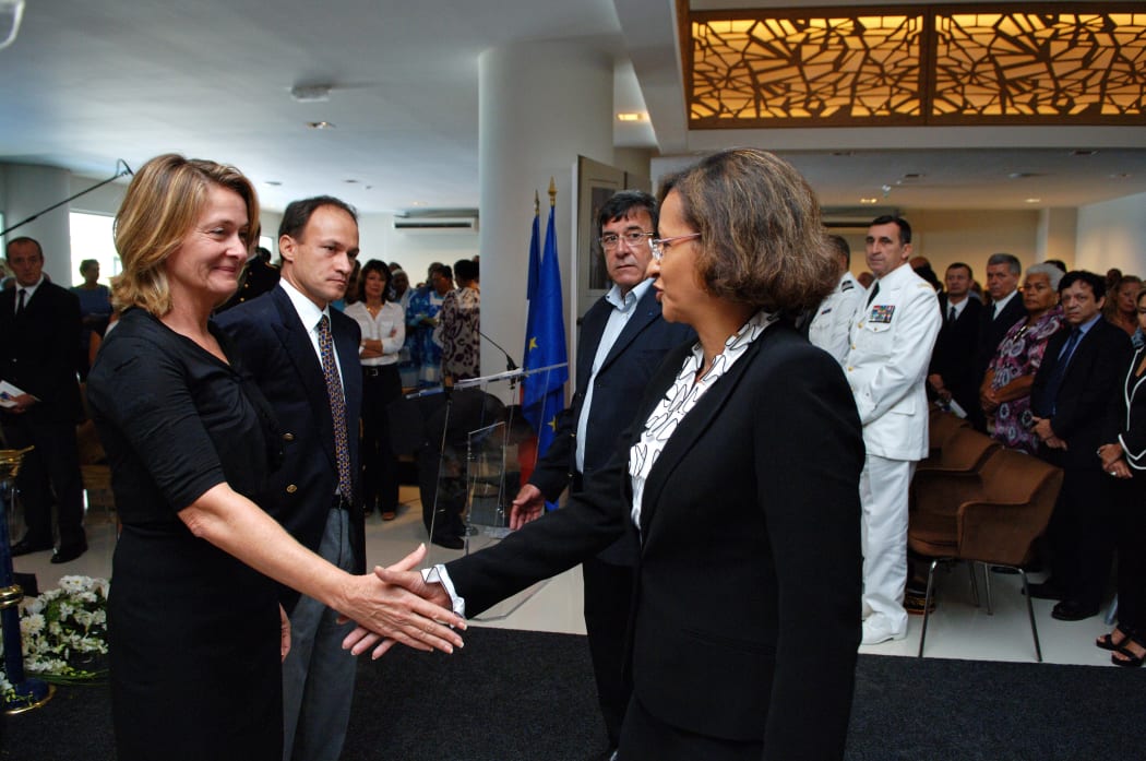 Overseas Minister Marie-Luce Penchard (D) presents her condolences to the daughter of Jacques Lafleur, Isabelle Lafleur (L), at the funeral of the former Member of Parliament for New Caledonia, on December 9, 2010 in Noumea.