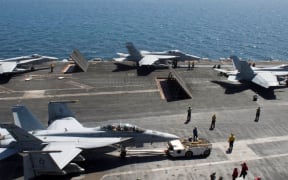 US Aircraft prepare for flight operations on the USS Theodore Roosevelt