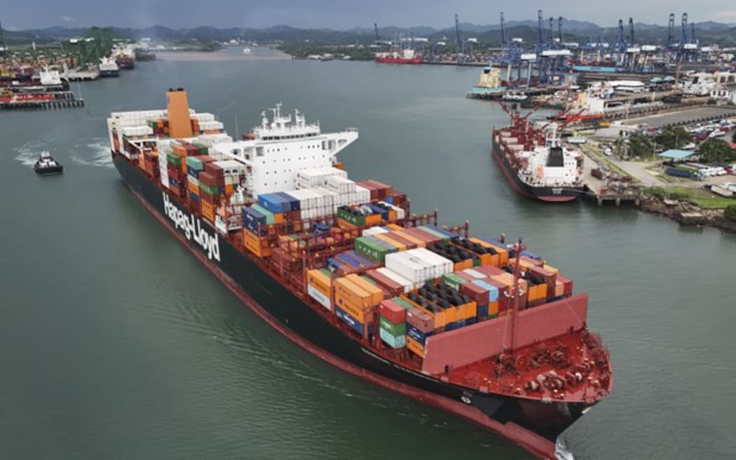 A cargo ship sails through the Panama Canal, in Panama City, Thursday, June 13, 2024.