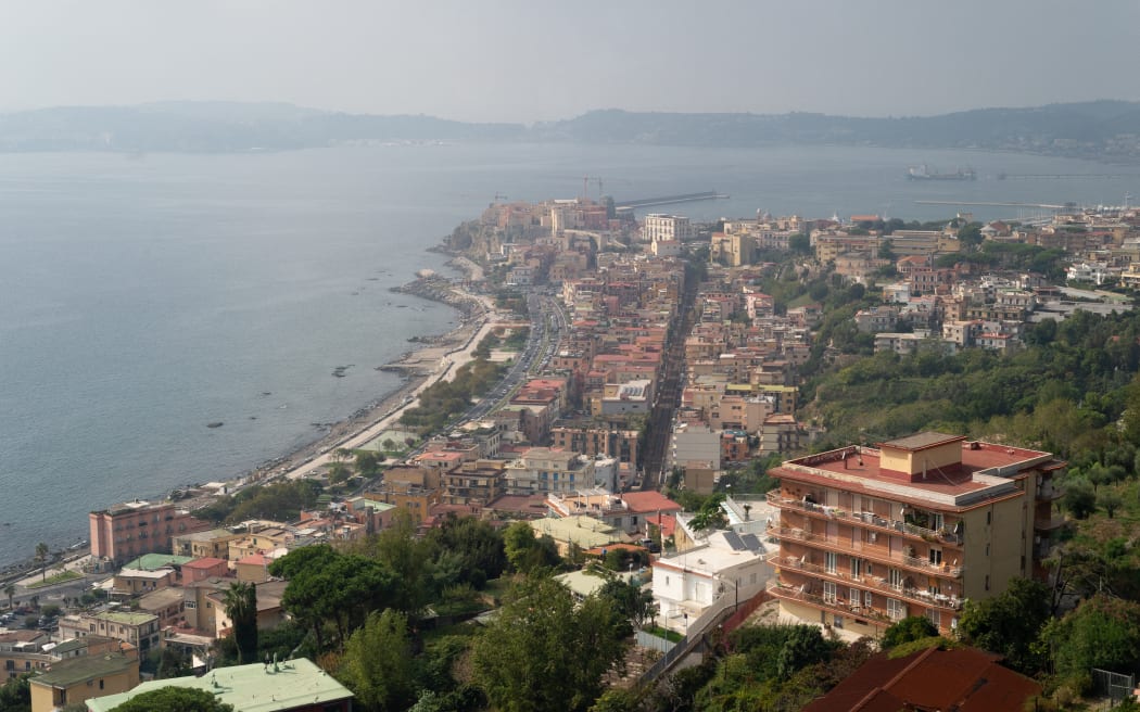 A picture shows the village of Pozzuoli in the Campi Flegrei (Phlegraean Fields) volcanic region in Pozzuoli on October 13, 2023. There have been many tremors in recent weeks, including two 4 magnitude quakes, the strongest in over 40 years. (Photo by Eliano Imperato / Controluce via AFP)